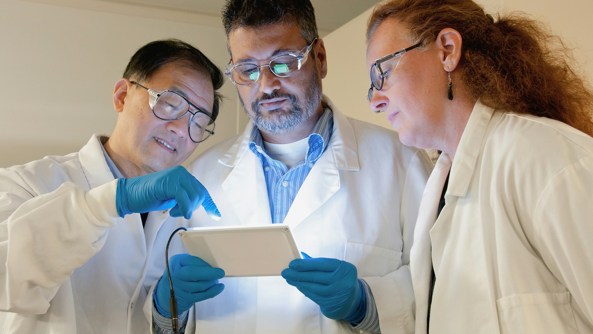 Pharmaceutical research laboratory with scientists and modern equipment